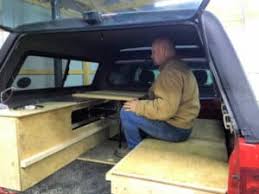 The completed table for a truck bed camper for two people Snail