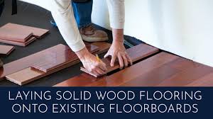 laying solid wood flooring onto