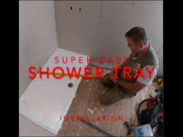resin shower tray on a wooden floor