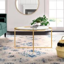That other parquet coffee tables are currently going for; Oval Gold Glass Coffee Table Wayfair