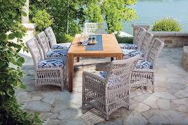 Wicker Chairs And A Teak Dining Table