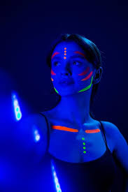 with ultraviolet makeup in neon light