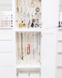 jewelry cabinet with pegboard hooks