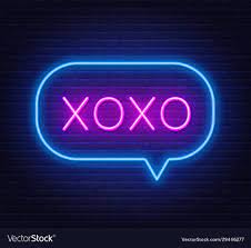 Neon sign xoxo on a dark background ...