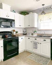 9 white kitchens with black appliances