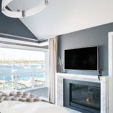 Dark Blue Wall With White Fireplace