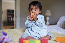 baby and with colorful toys