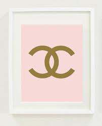 pink and gold chanel print wall art