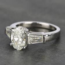 Oval Diamond Ring With Large Tapered Baguette Diamonds