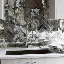mirrored herringbone backsplash tiles