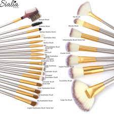 24 makeup brushes in cream roll case