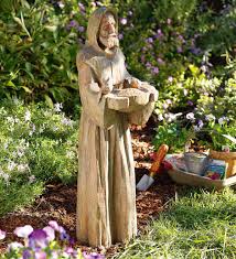 saint francis statue with bird feeder