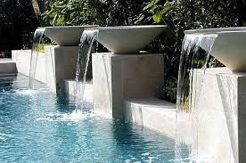 Swimming pools can greatly add a good ambiance to one's home. Breathtaking Pool Waterfall Design Ideas Pool Waterfall Backyard Pool Swimming Pool Fountains