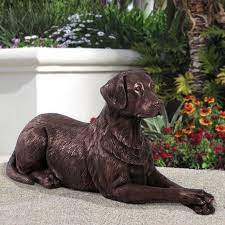 labrador lying down dog statue
