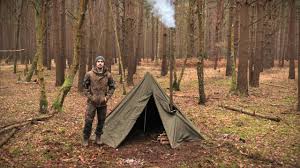 Those two words bring chilly memories of frozen boots and morning tent frost. Hobbit Tent Camping With A Woodstove Bushcraft Knife Backpack Early Winter Camp