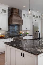 white cabinets with black countertops
