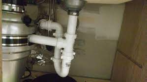 Use straight pipes and a t fitting to connect both drains into one line, and route the drainpipes into the main drain line. Help With Garbage Disposal Install And High Drain Pipe Home Improvement Stack Exchange