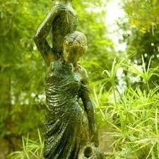 Concrete Statues Growing Moss Garden