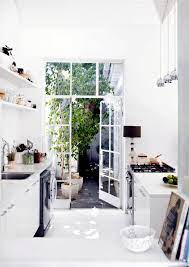 white kitchen with patio glass door