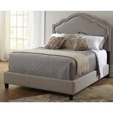 Shaped Nailhead Upholstered Bed By