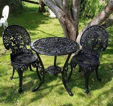 Cast Iron Table And 3 Chairs The