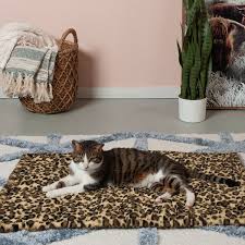 furhaven thermanap faux fur self warming pet bed mat snow leopard