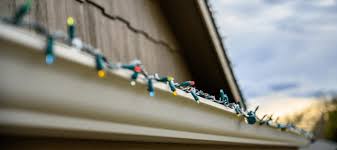 hang christmas lights from gutters