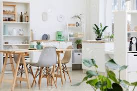 white modern kitchen with big table