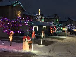 A house decorated for candy cane lane in 2017. All Is Bright On Candy Cane Lane Nw Calgary Homes Real Estate Mckelvie Group