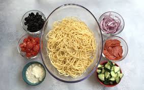 · to a large bowl add spaghetti, tomatoes, cucumbers, onion, and pepperoni. Italian Spaghetti Pasta Salad Family Fresh Meals