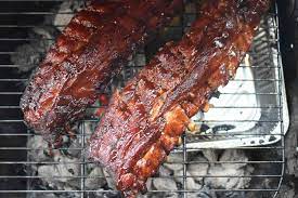 barbecue ribs on a charcoal grill