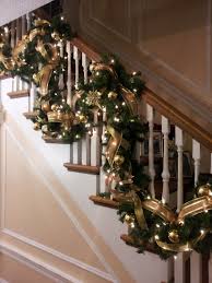 Banister decorated simply for christmas with garland and white ribbon. Christmas Garland Banister Maybe Do The Red Plaid Bows As Well Christmas Apartment Christmas Mantel Decorations Christmas Decorations Apartment