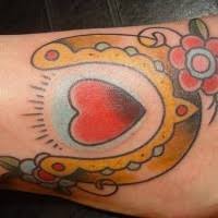 Whether you are getting your first tattoo or are looking to add another tattoo to your. Heart With Horseshoe And Flower Tattoo Tattooimages Biz
