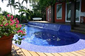 Glass Tile Pool With Oversize Waterfall