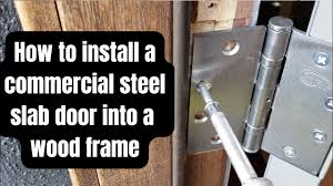 commercial steel door into a wood frame