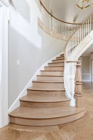 grand staircase and herringbone floors