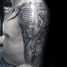 This arm sleeve tattoo is all about music! 60 Music Sleeve Tattoos For Men Lyrical Ink Design Ideas