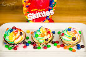 skittles cupcakes with rainbow icing