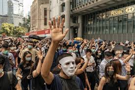 A protester wears a joker mask during a protest in hong kong on october 18, 2019.. Hong Kong Protesters Banned Under Emergency Law From Wearing Masks By Leader Carrie Lam Today Sparking More Protests Cbs News