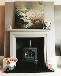 Carved Fire Surround With Wood Burner