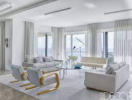 In rooms like this one that has large windows, it's a great idea to keep the furnishings simple and allow the eye to be drawn to the view. 35 Best Gray Living Room Ideas How To Use Gray Paint And Decor In Living Rooms