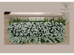 funeral garden and funeral casket spray