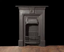 A Small Antique Cast Iron Bedroom Fireplace