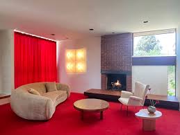 red rug and wall to wall carpeting