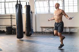 strong caucasian man exercising at gym