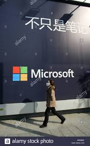 File A Pedestrian Walks Past An Advertisement For Microsoft