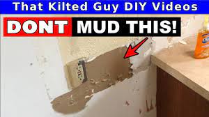 mud over torn drywall paper