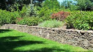 n l o l c stacked stone garden wall