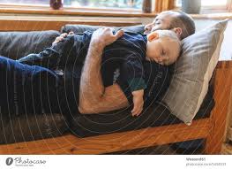 sofa with sleeping little son