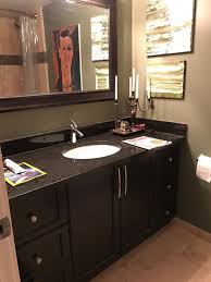 black granite and dark brown cabinets